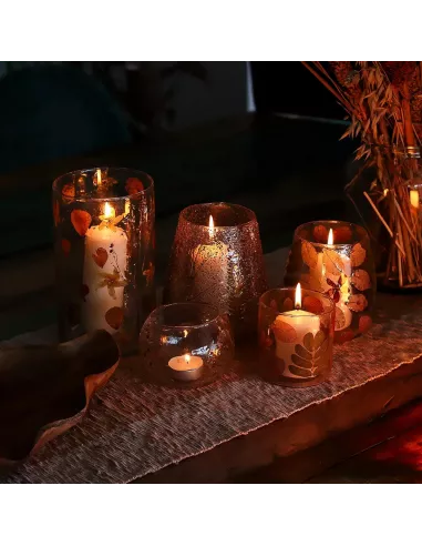 Conjunto varias portavelas de cristal encendidas